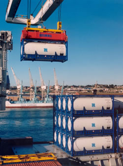 Tank containers being loaded onto a ship